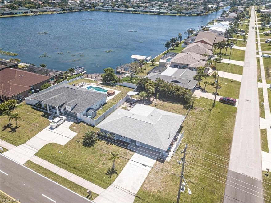 Located in a nice established SW Cape Coral neighborhood, this home boasts 3 bedrooms, 2 bathrooms, and a 2-car garage, making it the perfect space for your family to grow and thrive. The FULLY UPDATED kitchen features QUARTZ COUNTER TOPS, STAINLESS APPLIANCES, and NEW TILE flooring, creating a modern and luxurious feel throughout. The large center island is perfect for rolling out pizza dough or hosting family gatherings!  With IMPACT WINDOWS and a NEW ROOF in 2022, you can rest easy knowing your home is protected from the elements. The spacious and bright living area is FRESHLY PAINTED, creating a welcoming atmosphere for you and your loved ones to enjoy. The enclosed lanai/Florida room with vinyl windows provides a peaceful retreat to relax and unwind, even on rainy afternoons! The A/C was REPLACED in 2017 and this home is located OUTSIDE OF THE FLOOD ZONE which offers peace of mind. Don't miss your chance to make this  property your own and start living the Florida lifestyle you've always dreamed of!