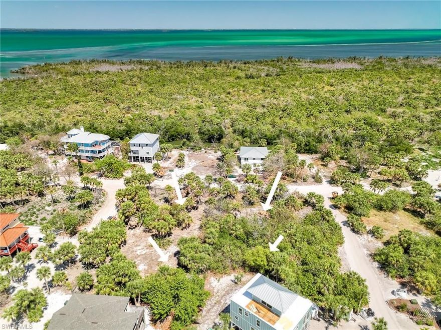 An incredibly rare opportunity on North Captiva Island! This collection of 4 adjacent lots spans a generous 1.13 acres, offering unmatched potential for a private estate with tropical gardens, a multigenerational retreat, or a 4-residence sanctuary. Enjoy exceptional privacy and the potential for sweeping bay and preserve views from upper levels over and around just 1 row of homes.  Ideally located near island dockage, the ferry landing, and club amenities, this property combines seclusion with convenience. Lots may be purchased individually or as a tailored collection that fits your vision.