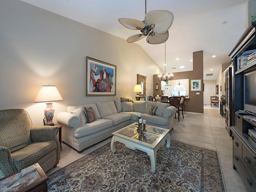 Immaculate, move-in ready villa in Monterey.  It features tile throughout, 3 bedrooms, one used as a den, 2 baths, dining and living room with vaulted ceiling opens to the extended, tempered glass enclosed lanai.  Kitchen offers a breakfast nook, Skylight, new SS sink, corian countertop and tile tile backsplash.  Master bedroom has a sitting area with french doors leading to a private patio and yard and lemon and avocado trees.  Large walk in master shower.  Guest bath is double entry and can be accessed from the hall.  The exterior of the villas was painted 2 years ago.  Lanai has electric hurricane shutters.  This villa is located in Monterey a gated community with clubhouse, fitness center, pool, hard tru tennis courts and is currently undergoing renovation and upgrading  This community is located close to the beach and Gulf, shopping, Philharmonic (Artis) performance center, adjacent museum, and Mercado.