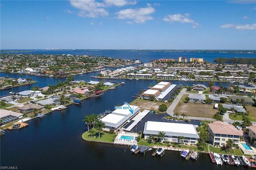 PRICE REDUCED**SELLER SAYS "WE ARE OPEN TO ALL OFFERS"**AMAZING 200'+ WIDE INTERSECTING WATER VIEWS**ONLY 2 TURNS TO CALOOSAHATCHEE RIVER WITH NO BRIDGES & ON TO THE GULF OF MEXICO**ATTENTION BOATERS...Condo comes with it's own BOAT SLIP to accommodate up to 30' vessel & owner can add LIFT**Additional Versatile Space as you enter can be a den, fam rm or additional Dining**BEAUTIFUL PEACEFUL Views off your own Private Lanai with Morning Coffee or Evening Cocktails**Friendly Residents that meet Poolside for Conversation & Postcard-like Sunsets**Walk to Riverfront Park at end of Beach Pkwy**RE-PLUMBED**Split Bdrm Floor Plan**Additional Storage Closet**Ready for your own Renovating Ideas but can move right in (pls know carpeting needs to be stretched)**Near Shops, Restaurants, Pubs, Banks, Hospital, Medical Centers, Post Office, etc & between both bridges to FM**30 mts to RSW International Airport**Healthy Association with good reserves. Will provide Association's P & L, Balance Sheet & Reserve Balance upon incoming Offer.