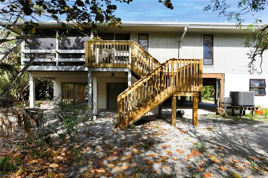 1139 Seagrape Ln, Sanibel, is a charming elevated home, ideally situated near the beach. Located within view of the Sanibel Lighthouse and a short walk to the pristine Sanibel beach. The interior of the home boasts 3 bedrooms and 2 bathrooms, providing ample space for comfortable living. The layout is designed to maximize functionality while maintaining a cozy atmosphere. There is a vaulted ceiling living room with fireplace and adjacent dining area. One of the highlights of this property is the screened porch off the living room and primary bedroom, perfect for enjoying the gentle gulf breeze and outdoor gatherings with family and friends. The private setting adds to the appeal, creating a tranquil retreat where you can relax and unwind. This home is an excellent choice for rom the Gulf, this home has endless possibilities.