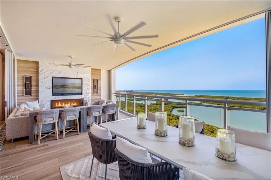 Penthouse 05 in Kalea Bay Tower 400 offers a rare combination of award-winning design, expansive Gulf views, and access to one of Naples’ most coveted five star developments.
This professionally designed residence—recipient of a Sand Dollar Award for interior design—features 10-foot ceilings, wood flooring, and exceptional custom millwork, designer lighting and built-in cabinetry throughout. The chef’s kitchen is equipped with Sub-Zero and Wolf appliances, including a natural gas cooktop, and is complemented by a fully outfitted butler’s pantry, providing additional preparation space and storage ideal for entertaining.
A striking architectural feature of the home is the 32 feet of sliding glass doors that open to the expansive outdoor living lanai. From here, the panoramic views sweep west and southwest across the Gulf of Mexico, stretching along the coastline toward Vanderbilt Beach and south toward Naples’ shoreline—delivering dramatic sunsets and an ever-changing coastal horizon.
The owner’s suite has the feeling of sitting on the water, framed by a wall of windows that creates the sensation of floating above the Gulf. The suite includes a spa-inspired bath and a substantial custom closet. Two additional guest en-suite bedrooms provide privacy for visitors, while a dedicated office offers a quiet workspace. Even the laundry room is thoughtfully designed, with custom cabinetry and generous storage rarely seen in condominium living.FOR CAR LOVERS THIS COMES WITH A EXTRA LARGE GARAGE THAT COULD FIT UP TO 3 CARS. 
Residents of Tower 400 enjoy access to the Kalea Bay Club, the centerpiece of the community’s amenity experience. The club features multiple resort pools, a full-service restaurant and bar, a state-of-the-art wellness center, tennis and pickleball programs, and a vibrant social calendar that creates a true resort lifestyle.
In addition, Tower 400 offers its own private rooftop amenity level, including a rooftop pool with sweeping views, outdoor lounge areas, and a rooftop fitness center designed to take full advantage of the Gulf vistas.
Penthouse 05 represents an exceptional opportunity to enjoy award-winning design, extraordinary Gulf views, and the full luxury lifestyle offered at Kalea Bay.