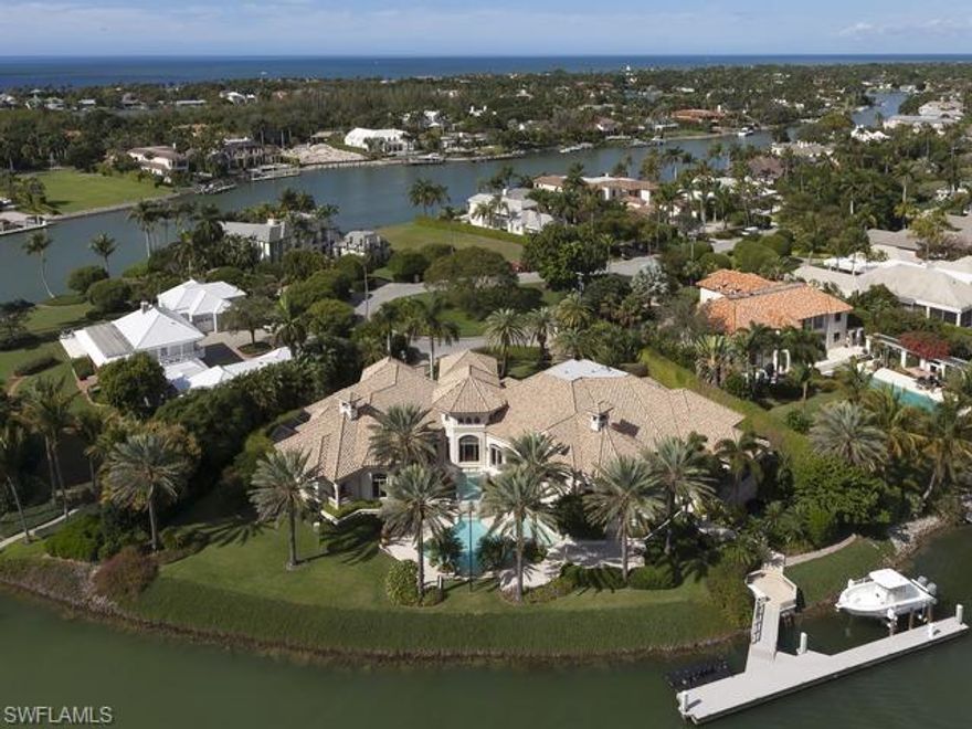 Truly one of a kind masterpiece by Hemmer Williams, Inc. Incredible home with detail only found in the finest properties. Panoramic water views from sweeping 280 degree lot and a half estate. Private 100  foot floating dock plus additional lift and watercraft floating pad. Fully gated and fenced this estate offers privacy and security. Full house automation, video, audio and a full theater. Unique single level floor plan featuring 4 luxury bedroom suites and a 5th suite designed as a private guest quarters with its own kitchen and private entrances. The master bathroom suite includes his and her baths, morning kitchen, dramatic shower looking out to the private orchid gardens and designer closets. Owners retreat just off master bedroom. 1000  bottle climate controlled wine room and full bar are perfect for entertaining. The outdoor space it just exquisite. Dramatic pool with reflecting fountains and a spa. Bridge over the Koi pond leads to the dock. Simply the best of Port Royal.