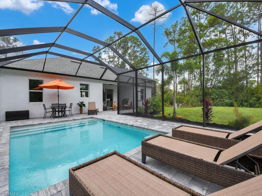 NEW CONSTRUCTION - HEATED SALT WATER POOL! Modern-style family home built with a terrific open-concept design on 1.59 acres! JUST BUILT IN 2020 w/ elegant French door entry, volume ceilings, porcelain tile & crown molding throughout, custom closet systems, designer cabinetry in kitchen, stainless steel appliances, Quartz countertops, luxury designed master bath, whole home reverse osmosis, and stunning outdoor living space offering a heated saltwater pool, extended pool lanai w/ pavers, covered sitting area, stainless steel gas grill & sink, plus picture frame screening. Very private setting w/ electric motor gate featuring a keypad. Wonderful neighborhood with NO HOA FEES and no restrictions! Minutes away from the Corkscrew Swamp Sanctuary which offers many miles of nature trails for walking and biking. Easy access to major roads including I-75, shopping & dining options, short drive to Ave Maria & public schools, plus only minutes to the Publix shopping center!