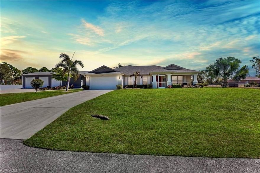 Welcome to the this meticulously maintained MAGNIFICENT 3/2 + Den HEATED salt water illuminated POOL home on a HALF ACRE nestled away on a quiet DEAD END street aside canal in the highly desirable SW side. This property has been nicely landscaped with excellent curb appeal & freshly painted spotlighting an outstanding INSULTED DETACHED 3 CAR GARAGE with two 10ft electric roll up doors plus Carport with RV hook up to electric, water, & septic including additional storage, Including an office under air & an impressive additional FULL BATH with attractive mosaic tile, custom mirror, and frame-less glass Walk in tiled shower with built in bench. These grand elevations with cathedral ceilings also highlight top level GRANITE countertops with a welcoming breakfast bar, Custom built illuminated Designer soft close cabinetry with unique integrated mixer lift from base & pull out lazy Suzanne plus Pull/out pantry shelving, crown modeling and light rail, an Attractive tiled backsplash, and Premium STAINLESS STEEL appliances with GAS cook-top and double door cabinet oven. This split floor plan with jack & Jill bath access also features Enticing Wood plank and porcelain tile, Smart faucet and upgraded fixtures, a Screened front patio with coffered ceiling, Newer water system & heat pump water heater, a desirable SOAKING tub, Jet shower panel system, glass French doors, IMPACT windows & doors, faux blinds, An R/O system, recessed lighting, utility sink, irrigation system, NEW pool pump, and an awarding (2022) screened back patio under trust with Outdoor anti-glare Tv & PRIVACY shrubs great for entertaining. Other notable features are Decorative shutters, Whole house gutter system, Video security & ADT security system, Smart photocell exterior lighting system, HIGH SPEED internet, Fully furnished negotiable. Just minutes to state road 82, major amenities, & a quick commute to Fort Myers. Schedule your showing today!