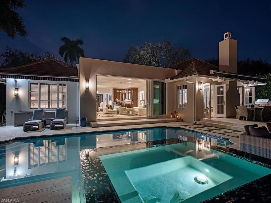 Sensational single level residence in exclusive Port Royal. Vastly redesigned home encompassing what today’s discerning buyer desires. Enter the distinctive foyer into the great room where walls of glass showcase sparkling views of tranquil Half Moon Lake. Brilliantly designed outdoor living spaces offer a grilling station, dining terrace, remote-controlled awnings, glass tile spa and pool with a fire pit surrounded by night-scape illumination. Open floor plan offers marvelous indoor/outdoor flow with interior hardwood floors throughout. Stellar chef’s kitchen with gas cooking, plentiful counter space, a large island with seating & wrap around cabinetry. Unique to this home is the overabundance of quality handcrafted custom cabinetry adding remarkable storage. Splendid southern exposure allows for a natural play of light in the chic serene living room & charming family sitting area. Sublime master suite overlooks the water. Two generously sized guest bedrooms contain capacious closets & en-suite bathrooms. This spacious 3 bedroom dwelling also includes a distinct home office with built-in desk, cabinets & bookcases. Brick paver circular driveway allows generous off-street parking.