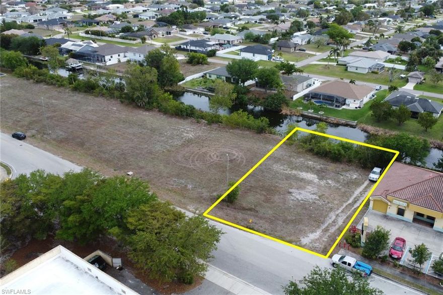 Prime commercial lot! Located in a booming section of Cape Coral, situated along a highly visible road with beautiful views overlooking a freshwater canal. This ready to build site is connected to city water and sewer, Flood Zone X (no flood insurance required), and comes with seller-provided plans and a recent survey to streamline your due diligence. Inquire for more details!