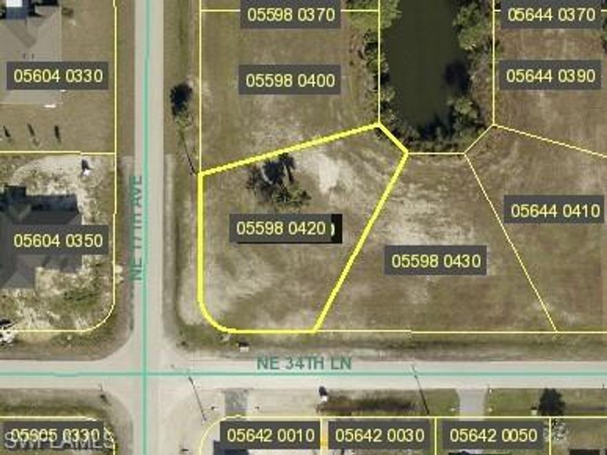 Perfect oversized corner lot, in growing Gator Circle with ample space to build your dream home.  The tranquil setting alongside the freshwater canal adds to its appeal, providing a peaceful and scenic environment for future use.