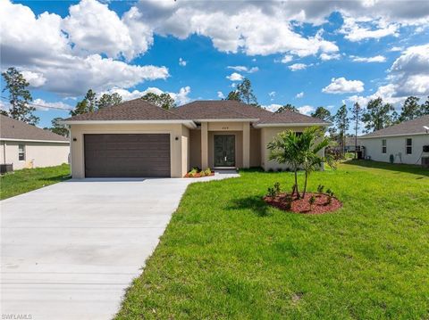 Photo of 469 Woodman DR Dr, LEHIGH ACRES, FL 33972 (MLS # 226009699)