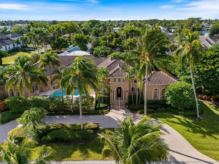 Located in the prestigious enclave of Aqualane Shores, adjacent to Port Royal, this spectacular residence truly offers it all. Spanning approximately 4,000 square feet of refined living space on one level, the home is filled with natural light and thoughtfully designed for both sophisticated entertaining and relaxed everyday living. Every detail reflects exceptional quality and craftsmanship—from the solid 8-foot core doors and custom millwork to the soaring ceilings that create an unmistakable sense of grandeur.
Relax in your first-floor, grand contemporary primary suite with multiple walk-in closets and a spa-inspired bath featuring dual vanities, a soaking tub, and a separate shower. Two additional ensuite bedrooms, a fourth bedroom currently being used as den and a sophisticated powder room complete the home, offering the perfect balance of style and functionality. Multiple indoor and outdoor living areas flow seamlessly, creating a lifestyle of comfort and ease. Step outside to your private resort, where an expansive marble-tiled lanai frames the heated pool and waterfall spa, while a fully equipped outdoor kitchen sets the stage for year-round al fresco dining and entertaining. Surrounded by lush, architecturally designed landscaping, this outdoor haven offers beauty, privacy, and tranquility. Just a short stroll from the sugar-white sands of the Gulf of Mexico, this exceptional home embodies the very best of Naples living—sophistication, serenity, and an unbeatable location. Aqualane Shores residents enjoy proximity to Naples’ vibrant culinary and cultural scene, with 3rd Street South and 5th Avenue South only moments away, offering award-winning restaurants, charming boutiques, art galleries, and open-air markets.
This is a rare opportunity for the discerning buyer seeking luxury, lifestyle, and timeless elegance in one of Naples’ most coveted neighborhoods. Your stunning home is ready for you to move in immediately (furnishings negotiable).