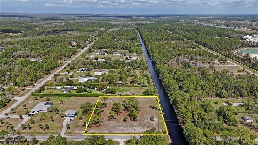 100% UPLANDS with side canal frontage! Don’t miss the opportunity to own 2.27 ACRES in desirable Golden Gate Estates. Situated just off Immokalee Rd, enjoy private, country living while being within close proximity of dining, Publix, CVS and more, plus a premier public golf course. Don’t miss the opportunity to build the home of your dreams on this nearly-cleared lot in a great location! Wetland Determination Report available.