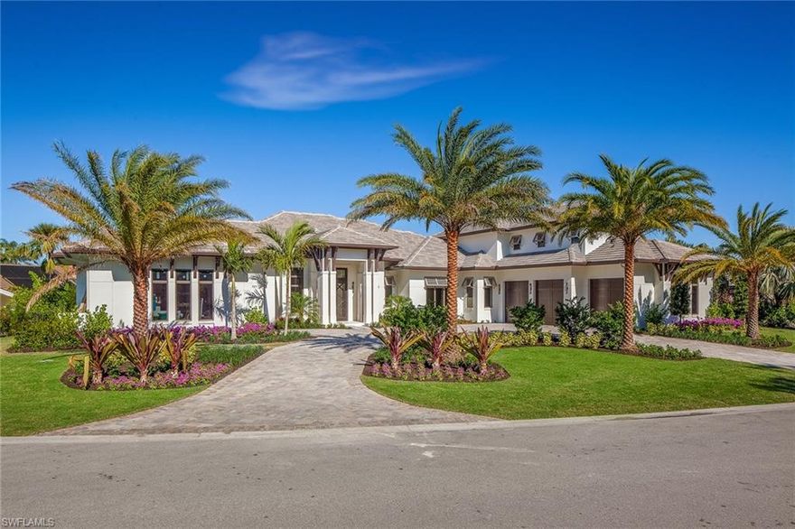 Imperial Homes of Naples presents an elegant coastal smart home in Pelican Bay, with the finest finishes and details throughout. An extensive island kitchen features Sub-Zero and Wolf appliances, a second butler’s kitchen, climate controlled wine cellar, and full bar. Upper level VIP suites feature a separate morning kitchen and laundry for long staying guests or in-home health care assistants. Dual home offices and an exercise room round out this complete lifestyle home.  This light and bright home offers exceptional resort-style outdoor living with a saltwater pool and spa, summer kitchen and bar, large seating area surrounding a stone fireplace, all protected by roll down screens and storm shutters. Featuring the only four car garage in all of Pelican Bay.  This ideal location affords walking distance to Artis and Waterside Shops, and just a quick jaunt to the beach tram and tennis at the Commons.