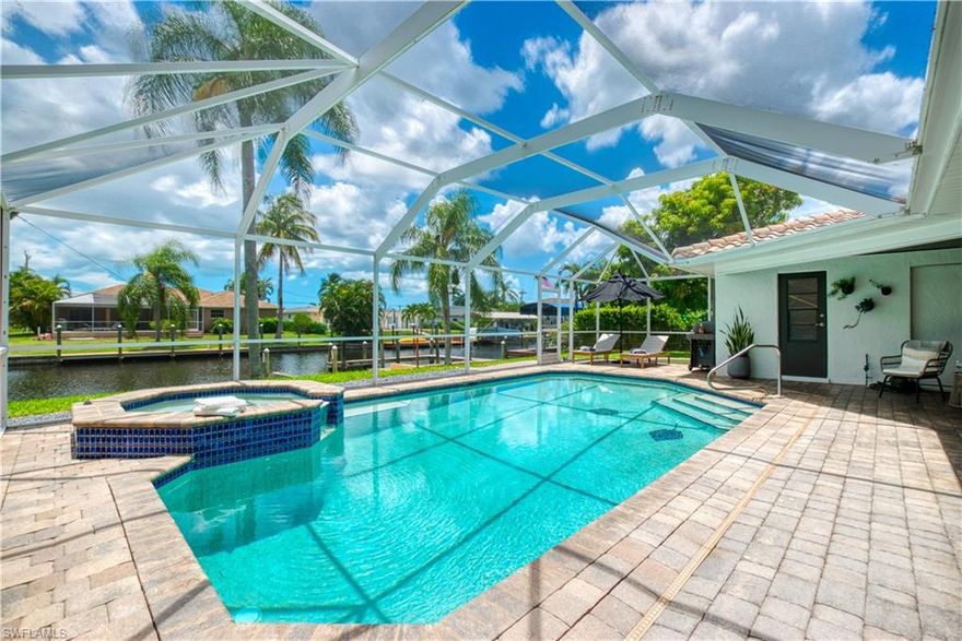 Sailboat Waterfront Estate | Southern Exposure | Proven Income Producer Experience turnkey waterfront ownership in this fully renovated southern-exposure home offering fast, unrestricted sailboat access to the river and open Gulf waters within minutes. Ideally positioned near Tarpon Point Marina, waterfront dining, and upscale shopping, this property sits in one of the city’s most desirable boating and short-term rental corridors. The residence has been extensively updated and is truly move-in ready, eliminating the risk and downtime of a renovation project. Improvements include wood-look tile flooring, custom cabinetry, modern countertops, updated bathrooms, designer lighting, a statement fireplace feature wall, impact-rated windows and garage door and Storm Smart Shutters. Designed for indoor-outdoor living and entertaining, the home features expansive pocket sliders opening to a large paver pool deck, private dock with tiki hut, and deep-water canal frontage. A 16,000-lb boat lift accommodates larger vessels, while a convenient kitchen pass-through window enhances poolside and dockside entertaining. The oversized guest bath also functions as a dedicated pool bath. Currently operating as a successful vacation rental, the property offers immediate income potential with the option for the new owner to continue the existing rental program. A custom DamEasy flood-protection system provides added security and long-term asset protection. An exceptional opportunity for boaters, investors, or buyers seeking a luxury waterfront lifestyle with strong income upside.