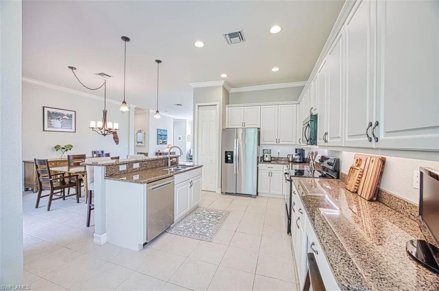 Fantastic opportunity to live in the fastest growing part of town! Everything is here - Whole Foods, Top Golf, endless restaurants, the ball parks, public golf courses, the Lee County bike and jogging trail system, and miles of conservation land. This incredible condo offers  over 2100 square feet of light and bright living space in with a  2 car garage.  Second floor with a peaceful preserve view on a wide private lot. White trims and cabinets, granite counters, tile in the public areas, and custom fixtures throughout.  2 full private baths and a powder room for guests This is a wonderful space and designed for today's lifestyle. The den or 3rd bedroom has a custom murphy bed to provide that additional sleeping space when needed but allows the flexibility to be used for gaming, training, or work.  The owner’s suite is enormous with a bath that features dual sinks, and a separate tub and shower.  Portofino dues include water, sewer, internet, cable and insurance – everything but your electric bill.    No CDD – No City Tax.    This should be at the top of your must see list!