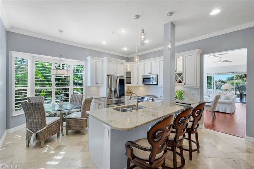 Elevated coastal luxury in the heart of North Naples-Welcome to Residence 4-201 at Les Chateaux, an exquisitely renovated second floor END UNIT nestled within the prestigious Pelican Marsh community. Offering the privacy of NO RESIDENCE ABOVE, A VIEW OF THE COMMUNITY FOUNTAIN and the convenience of a PRIVATE 2 CAR GARAGE WITH EPOXY FLOORING AND BUILT-IN STORAGE, this sophisticated home blends timeless elegance with modern comfort in one of Naples' most coveted locations. Refined interiors designed with both beauty and functionality in mind, this expansive 2216 square foot Versailles floor plan showcases 3 SPACIOUS BEDROOMS AND TWO AND ONE HALF BATHS, ELEGANT TRAVERTINE FLOORING complimented by RICH WOOD finishes and a LIGHT FILLED open layout ideal for entertaining. At the heart of the home, the designer kitchen impresses with sleek GRANITE COUNTERTOPS, CUSTOM MOSAIC TILE BACKSPLASH, UPGRADED APPLIANCES, SOFT CLOSE CABINETRY, NEW WASHER AND DRYER AND RECENTLY UPDATED LANAI ALSO WITH TRAVERTINE FLOORING AND NO-SEE-UM SCREENING. The luxurious primary suite and guest accommodations are enhanced by spa inspired bathrooms featuring MARBLE AND GRANITE DETAIL, WHITE PLANTATION SHUTTERS, while CUSTOM CLOSET SYSTEMS add a polished tailored feel throughout. Step into your private screened lanai where tranquil views of lush tropical landscaping create a backdrop for morning coffee or evening relaxation. This peaceful retreat captures the essence of Naples indoor-outdoor lifestyle. Additional exceptional details include solid concrete construction with classic tile roofing, all in a quiet low density enclave offering the ultimate in privacy and charm. The resort-inspired living at Pelican Marsh offers residents at Les Chateaux exclusive access to private pool and spa along with world class amenities which include state-of -the -art fitness center, tennis, pickleball, bocce courts, scenic walking and biking paths, elegant clubhouse and optional golf membership. Just minutes away, experience the best of Naples- pristine Gulf beaches, upscale shopping and fine dining at nearby Mercato and Waterside shops. Whether as a full-time residence or seasonal escape, this exceptional home offers luxury, privacy and effortless living in one of North Naples' premier gated communities. Truly a distinguished Naples retreat!!