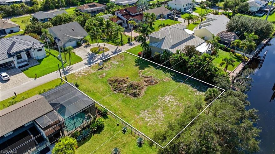 Discover a rare opportunity to own a premier Gulf-access waterfront homesite in the heart of Bonita Springs, where luxury, lifestyle, and location meet. Perfectly positioned along a tranquil canal with direct boating access through the scenic Imperial River to Estero Bay and the Gulf of Mexico, this property offers the ideal canvas to build the custom home of your dreams. Whether you envision a sleek modern coastal retreat or an elegant Old Florida-style residence, the possibilities are endless. This exceptional residential vacant land is being offered for land value only, yet the sellers have thoughtfully prepared architectural plans for a spectacular custom residence, giving prospective buyers or builders an exciting head start toward realizing their vision. The proposed design highlights the best of Florida living—an open-concept layout with seamless indoor-outdoor transitions, expansive living areas, and a resort-style pool overlooking the water. Whether you choose to move forward with the existing plans or collaborate with your own architect and builder, this site presents a remarkable opportunity to create a true coastal masterpiece tailored to your exact specifications. For boating enthusiasts, the property’s direct Gulf access via the Imperial River offers effortless navigation through mangrove-lined waterways, ideal for fishing, kayaking, and sunset cruising. Located just minutes from Bonita Beach, Barefoot Beach, Riverside Park, and the vibrant Promenade Shops, you’ll also find a wide array of local dining, entertainment, and shopping options close at hand. Enjoy easy access to U.S. 41 and I-75, placing you within a short drive of Naples, Fort Myers, RSW International Airport, and all that Southwest Florida’s Gulf Coast has to offer. With no HOA restrictions and an unbeatable blend of natural beauty, boating lifestyle, and convenience, this property delivers an extraordinary opportunity to build in one of Bonita Springs’ most sought-after waterfront corridors. Embrace the freedom to design every detail of your personal paradise—where every sunrise over the water marks a fresh beginning, and every evening invites the relaxed rhythm of life on the coast.