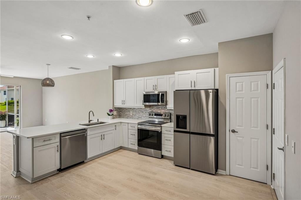 Photo of 1104 Oxford LN #44, NAPLES, FL 34105 (MLS # 226028106)