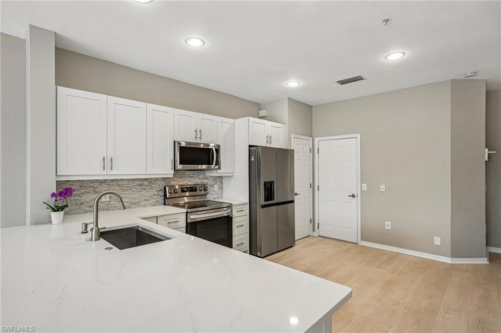 Photo of 1104 Oxford LN #44, NAPLES, FL 34105 (MLS # 226028106)