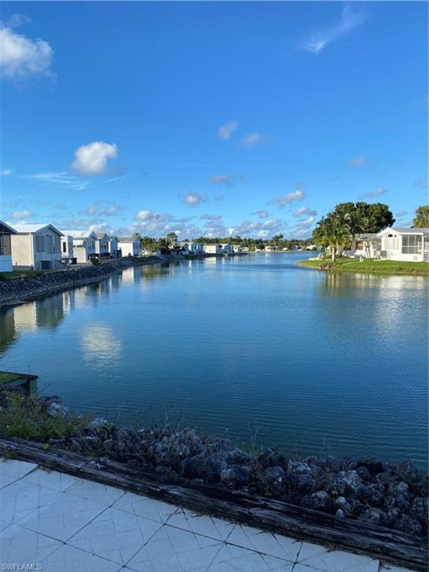 This is one of the prettiest lots in Imperial Wilderness!  Imperial Wilderness is an active, gated, 55 plus community where you actually OWN the land.  This is NOT a co-op!  Currently the lot is set up and ready to go for your RV use. It is cemented and it has full hook up.  It even has a shed complete with indoor and outdoor lighting and with the electrical hook up done for a washer and dryer.  Only the plumbing has to be done.  You will love the lake views as you enjoy the beautiful weather that Naples is known for.