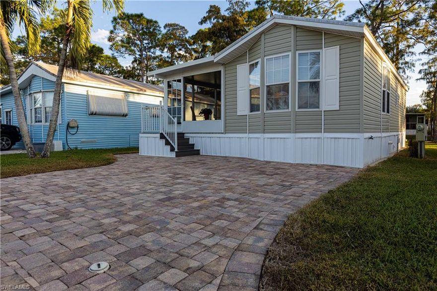 You are going to love this one! It is located in the gated, active, 55 plus community of Imperial Wilderness where you OWN the land. This beautiful home was made in 2011 and it is beautiful!  When you walk into the lanai entrance, you will notice that the huge, open, screened lanai is completely done with composite so you should never have to worry about wood rot in the SWFL tropical climate.  Behind the lanai, you will find an open porch that looks out over a peaceful common space that includes a grove of trees.  As you enter the home, you will notice the spotlessly clean white cabinets and the lighter décor which makes the home nice and bright.  The homeowner has had everything right down to the windows, walls, and furniture professionally cleaned so it is ready for you to just move right in.