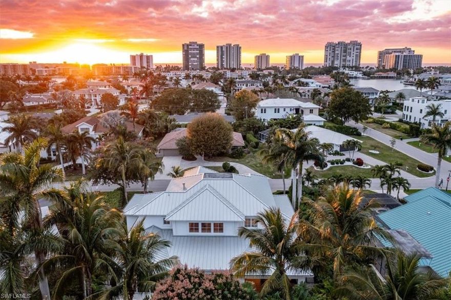 Gorgeous old Florida Style property showcases the timeless beauty of wide plank hardwood flooring throughout. The first-floor great room
boasts 24’ high ceilings, fireplace and built-ins. Fabulous gourmet kitchen with a Large WOLF gas range, double ovens, espresso machine, and
SUBZERO refrigerator/freezer. A perfectly located wet bar area features a wine cooler and beverage refrigerator. Coastal elegance is evident
with tongue & groove ceiling treatments, built-in niches, a wide staircase, and detailed railings. Additional highlights include a Butler’s pantry
and a dreamy, spacious laundry area. The owner’s suite on the first floor features vaulted ceilings, extensive millwork, 2 large closets, and a
spa-like en-suite bath. Upstairs, a huge loft space/media room and three full guest suites with en-suite baths and ample closet space await.
Outside, a beautiful covered lanai with motorized screens, a fireplace, summer kitchen and bar, living and dining rooms, and a 32 ft. pool & spa
with ample decking create the perfect outdoor oasis. The yard and grounds are meticulously landscaped. The property is within walking distance
to an exclusive private beach, shops, and bistros.