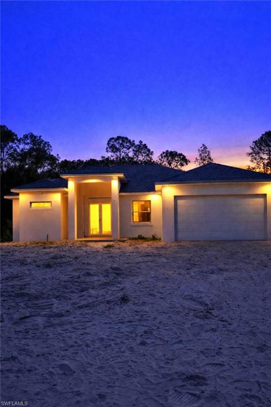**HOME IS UNDER CONSTRUCTION- EXPECTED COMPLETION DATE FOR END OF MAY 2026**

Exceptional opportunity to own a New Construction home situated on a desirable ½ acre lot in Lehigh Acres. This thoughtfully designed residence offers 1,943 sq ft of living space and nearly 2,700 total sq ft under roof, blending modern design with functional living. 

The open-concept floor plan features 4 bedrooms, 2 full bathrooms, and a spacious 2-car garage. The heart of the home showcases a seamless flow between the kitchen, dining, and great room, ideal for both everyday living and entertaining.

Designed with Florida living in mind, this home includes impact windows and doors for added safety, energy efficiency, and peace of mind. Large sliding glass doors lead to a covered lanai with a summer kitchen, creating the perfect indoor-outdoor lifestyle.

The primary suite offers a private retreat with walk-in closets and en-suite bath, while the additional bedrooms are well-sized and positioned for privacy.

Set on an oversized ½ acre lot, there is ample room to add a pool, expand outdoor living, or simply enjoy the extra space and privacy.

Don't miss out, schedule a showing today!