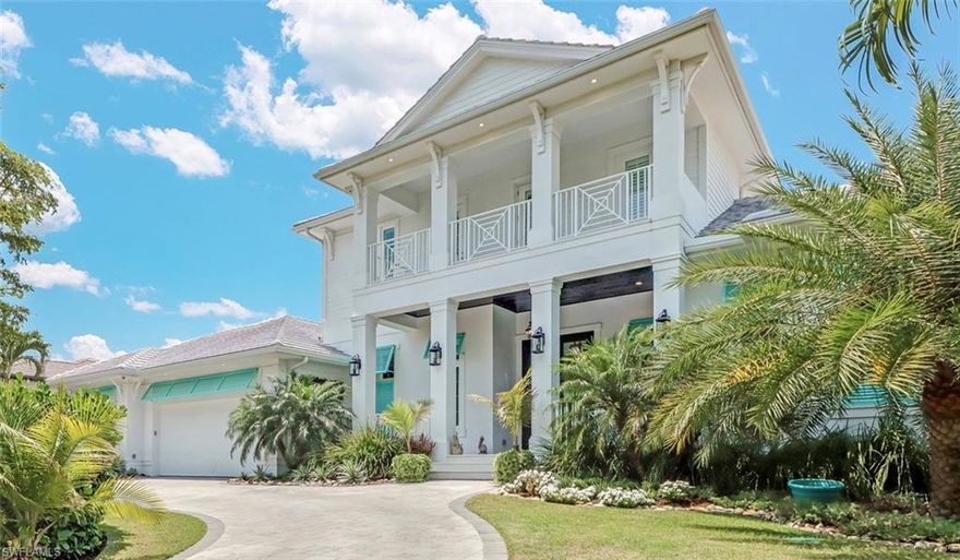 SEAGATE – This 2019 Coastal Contemporary estate home offers 5 bedrooms and 5 ensuite baths, guest bath, separate den, and oversize 3-car garage. The exterior is beautifully landscaped and includes coconut palms, circular drive, custom gas-heated pool/spa, and summer kitchen.  There is a new dock with lift that offers plenty of room for your kayak or jets skis with access to Clam Pass. The home features 12-foot custom ceilings, wide plank white oak flooring throughout the residence, 2 laundry facilities, and gas fireplace. In the chef’s kitchen are Thermador appliances and an oversized island fitted with a Kohler farmhouse sink. The private master suite has his & hers walk-in closets, a spa-like bath with dual vanities, multiple shower heads, and soaking tub. Upstairs is a game loft, 3 bedrooms each with ensuite bath, and spacious covered terraces to enjoy Florida’s tropical breezes. Other notable features are: a cabana bath, Homeseer and Lutron smart-home, gas tankless water heaters, prewire for elevator and generator, and new seawall. Note: Seagate is easy walking distance to Waterside Shoppes and Gulf beaches. Optional membership in the Seagate Beach Club is available.