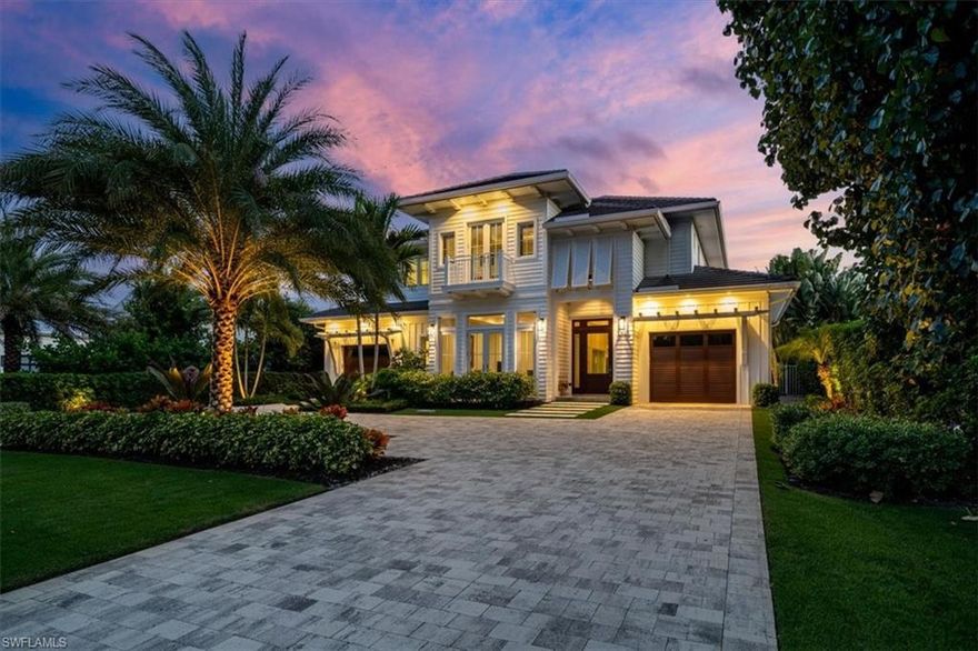 H3842 -Better than new model home on an oversized Olde Naples lot! Spectacular upgrades and level of finishes throughout this fabulous home with separate guest house. This sprawling 5,012-square-foot home is located in the heart of Olde Naples on a non-cut-through street. Close proximity to beautiful beaches and Downtown Embrace the Florida lifestyle from this home’s expansive outdoor living area with pool and spa, summer kitchen, and covered and uncovered seating areas all accented by the glow of fire bowls. This home features wide-plank hardwood flooring, tankless hot water systems, a camera security system, an elevator,five bedrooms, five plus two-half baths, a den and guest casita. The custom glass wine room is designed with a stylish, contemporary wine rack featuring a sensory-driven climate-controlled chilling system. The chef will enjoy the Miele® appliances, quartz countertops, and custom-built cabinets. Entertain with ease with a large open concept floor plan transitions seamlessly to stunning outdoor spaces. This home showcases the best of Florida living indoors and out.