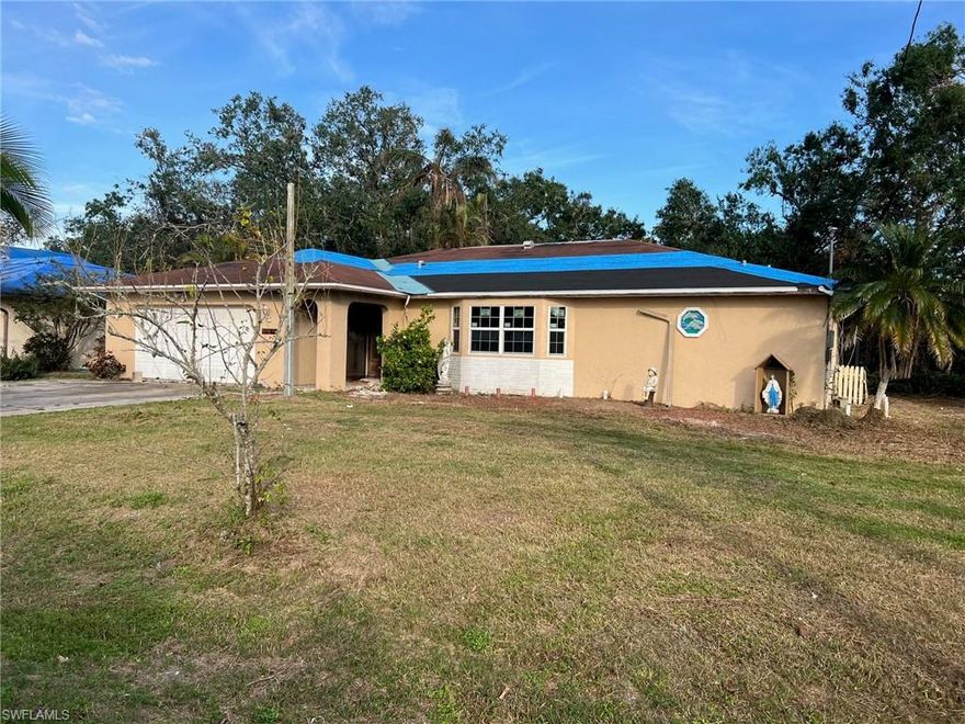 INVESTOR'S SPECIAL! This one of a kind property with a very large backyard is located with convenience to 41, Downtown Fort Myers, and shopping! The oversized yard has a huge detached concrete garage that is 30' x 40' with 2 large bay doors. Parts of the home were affected by a fire (nonstructural damage. Drywall removed and studs treated), and these parts have been demo'd and remediated. This house is just awaiting your desired touches to make it yours! The home boasts an amazingly large private backyard with paved paths!