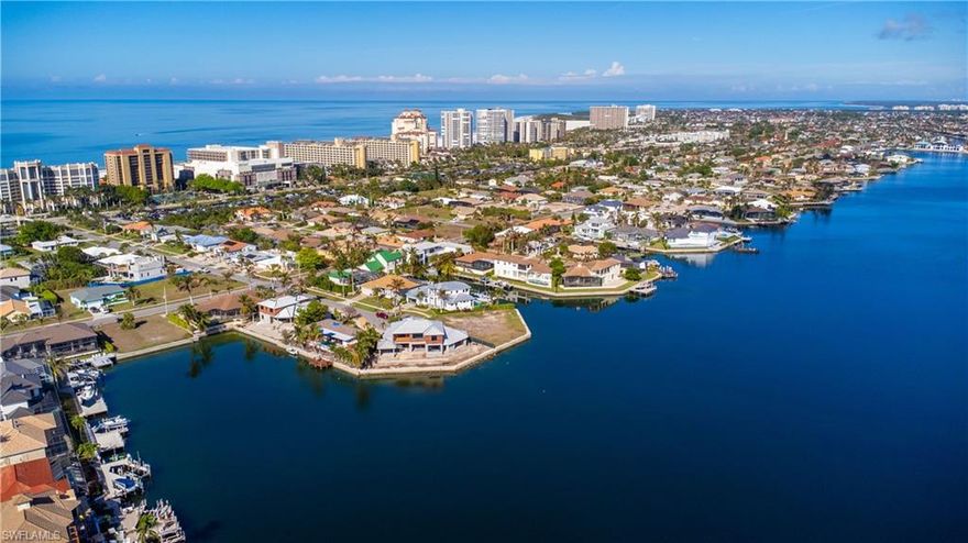 Estate Sale ***SELLERS OFFERING $25,000 closing cost credit to buyer** Rare opportunity to own this never listed architect/owner-built home. Enjoy your morning coffee watching the wide canal view soaking up the colors of the sunrise 1 block to the beach access for evening sunsets! Your new home features a 16,604sqft Lot 3 bedrooms plus den 3 bathrooms AND home theater room! Whole house stereo system with individual speaker sound control. Wired alarm system. Screened in pool & spa as well as two exterior lanais. Gas heated pool/spa & 250 gal. propane tank. This large custom open floorplan provides natural light to all rooms. The master suite has direct access to the rear lanai, walk in closet & soaking tub in the primary bath.  Water filtration system at kitchen sink & fridge. Laundry room has utility sink & additional storage. Theater room located off the kitchen & laundry room.  Garage features oversized garage door ample storage & parking for up to 4 cars. 2 AC units UV light filtration new in 2021 Pool pump/filter 2022 Roof 2018 Glass sliding doors are 110MPH hurricane rated. Located South of San Marco Rd 20 min to the Gulf by boat. 8 min walk to Winterberry public beach access.