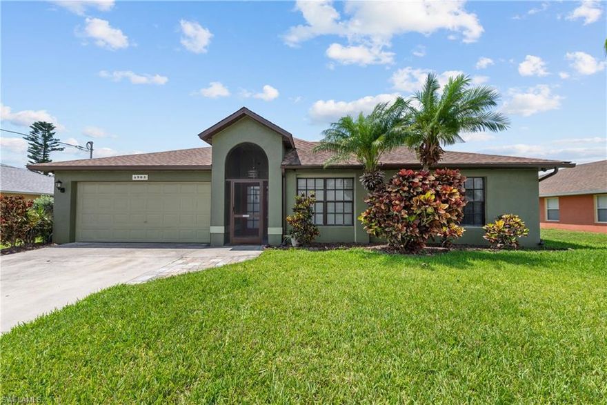 Imagine enjoying all that sunny southwest Florida has to offer in this beautiful 3 bedroom, 2 bathroom pool home.
Enjoy family and friends gathering on your oversized lanai, swimming in the pool while BBQing on the extended patio. Plenty of space to play, relax and enjoy. The large kitchen has a center island and granite countertops with plenty of space for cooking with teh dining room steps away making it perfect for entertaining. The open concept of this home extends to the living room with beautiful accent wall. This home features the popular split bedroom floor plan. The master bedroom overlooks the pool and has it's own ensuite and large walk in closet. The two additional bedrooms also feature walk in closets allowing for plenty of storage. The separate laundry room leads into the two car garage. No worries about major repairs either! The roof, AC, water system and pool pump have all been replaced in 2019. Some furnishings are also included! The location is perfect with Buckingham Park being just minutes away. This home is also close to the airport, restaurants, shopping and another hop, skip and a jump and you can be at several nearby beaches. Put this one at the top of your list, you will not be disappointed.