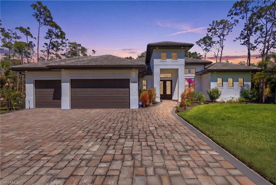 Set on a 1.25-acre parcel in San Carlos Estates, this custom-built residence delivers the space, privacy, and freedom that are increasingly hard to find—no HOA, no compromises, and no one looking over your shoulder. Surrounded by a canopy of Florida pines, the setting feels tucked away and tranquil, yet remains just minutes from everyday conveniences, dining, and the continued revitalization of Old Bonita, where local favorites, new restaurants, and a growing arts and culture scene are redefining the area’s appeal. Inside, a clean, modernized interior unfolds with a bright, open-concept layout designed for effortless living. Impact-resistant windows and doors invite natural light while offering peace of mind, complementing wide expanses of porcelain tile flooring and a cohesive, elevated aesthetic throughout. The great room serves as a striking focal point, where detailed carpentry—including a coffered ceiling and feature wall—is beautifully highlighted by fresh paint that enhances depth and contrast and newer light-filtering shades throughout. At the heart of the home, the gourmet kitchen impresses with exotic quartzite countertops, soft-close cabinetry, and a full suite of KitchenAid appliances, seamlessly connecting to the main living spaces. The thoughtfully designed floor plan includes four bedrooms plus a den, offering flexibility for work, guests, or creative pursuits. The primary suite is a retreat of its own, featuring a custom-designed closet, a freestanding soaking tub, dual vanities with a dedicated makeup station, and a calming, spa-like ambiance designed for unwinding at the end of the day. Outdoors, the property lives just as expansively. A silver travertine patio creates a refined setting for outdoor living, while the generous acreage offers ample room to design your dream pool, guest house, or additional outbuildings. Mature landscaping, a five-zone irrigation system, an oversized three-car garage, and a sweeping driveway complete the offering. A private, acreage lifestyle paired with modern design, generous space, and a location that keeps you connected—this is San Carlos Estates at its best.