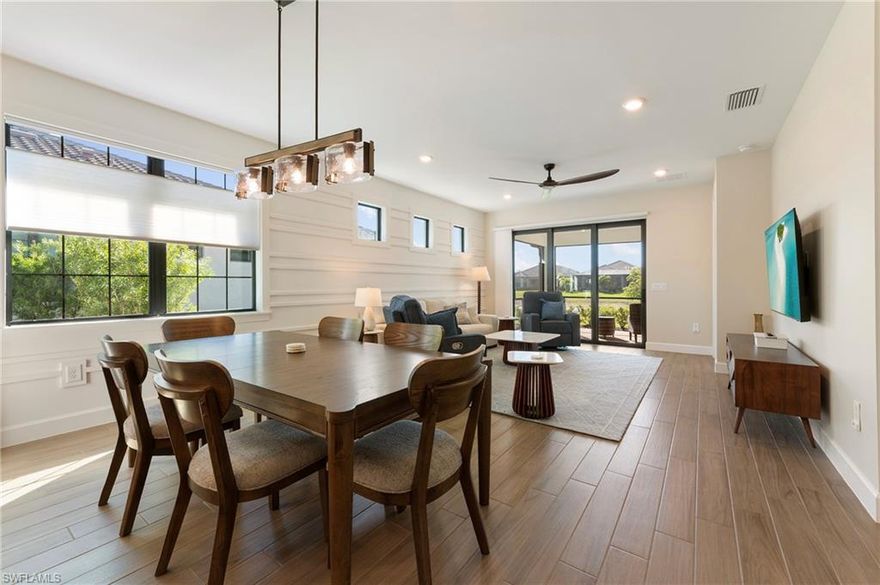 2027 SEASONAL RENTAL AVAILABLE DEC - APRIL @ $8,000/MONTH AND ANNUALLY/OFF SEASON @$4,000/MONTH (RENTED FOR SEASON 2026). This beautifully furnished Ellenwood villa is set on a peaceful waterfront lot with sunny southern exposure and tranquil views.
The home offers 2 bedrooms, 2 full baths, and an enclosed den, with no carpet throughout. Wide plank tile flooring flows through the entire home, complemented by custom accent walls, tray ceilings, recessed lighting, and modern ceiling fans.
The upgraded kitchen features quartz countertops, white cabinetry, stainless steel appliances, gas range, tile backsplash, center island with seating, and pendant lighting.
The primary suite includes a tray ceiling, accent wall, and a spa-style bath with dual quartz vanities and a walk-in glass shower. The guest bedroom and second bath are equally well finished.
Sliding glass doors open to a screened, covered lanai with paver flooring and peaceful water views. Additional features include a laundry room with storage and a two-car garage with epoxy flooring.
Residents enjoy an exceptional resort-style community featuring a grand clubhouse, social lounge, on-site dining, fitness center, pickleball and tennis courts, lakefront beach area, sparkling resort pool, cabanas, community park, and scenic walking and biking paths. A full calendar of social events and activities creates an active, vibrant lifestyle.