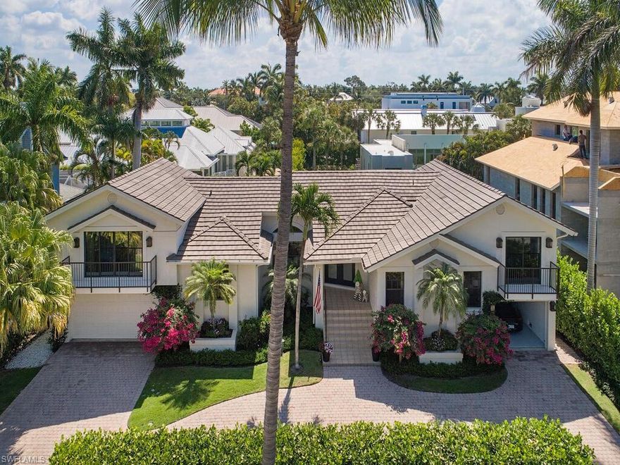 H2362 - Nearly every corner has been renovated in this enviously-located residence found merely one block from the Gulf's of Mexico's turquoise waters and two blocks from Third Street's fine dining and shopping.  Beyond the home's frosted glass-pane and wood doors, light infuses every angle of the thoughtfully-designed floor plan, filling it with a sunny sophistication that is sure to be enjoyed by residents.  Nearly 2,700 sq feet hosts five bedrooms, three of which feature en-suite bathrooms to afford maximum privacy for guests, as well as a three car garage.  Outdoors, a spacious lanai and heated swimming pool are surrounded by tall hedges, bidding a concealed relaxing retreat for a post-beach "cool off" or for a summer barbecue amongst friends and family.  Infusing delightful touches of serendipity, features such as French White Oak wood flooring, sleek pearly white bathrooms, as well as dazzling fixtures throughout truly reflect the coastal spirit of Naples' living everywhere!