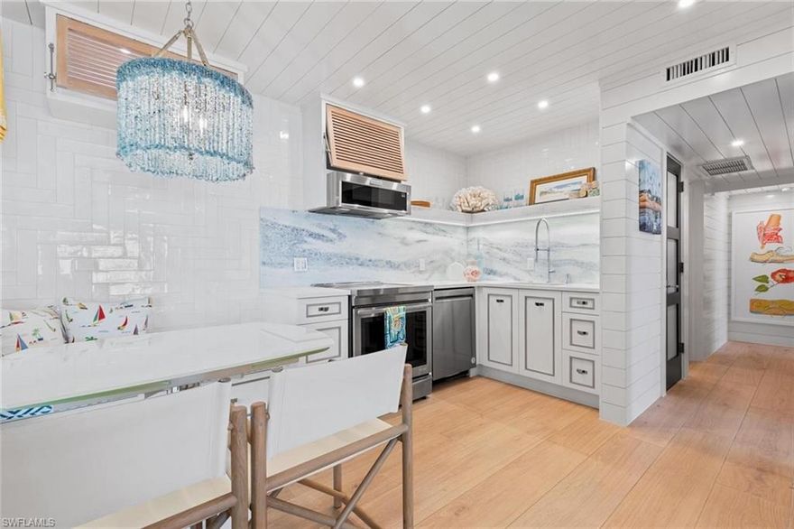 Embrace the island lifestyle in this beautifully renovated 2-bedroom, 1-bathroom first-floor condo, located in the sought-after Ville de Marco community on scenic Marco Island. Blending coastal charm with modern updates and storm-ready features, this residence offers both peace of mind and a true getaway feel. Inside, every detail has been thoughtfully designed — from shiplap-accented walls and ceilings to designer wallpaper, custom tilework, and plantation shutters. Durable tile floors throughout the living spaces and bathroom add style and easy maintenance, while oversized baseboards and high-end finishes create a refined look. Impact-resistant windows and sliders flood the condo with natural light, enhancing energy efficiency, quiet comfort, and storm protection. Step outside to your private covered patio, ideal for morning coffee or evening cocktails under Marco Island’s glowing sunsets. With a boat dock lease available for under $500 per year, you’ll have easy access to the waterways. Whether you’re looking for a personal island escape, a full-time residence, or a savvy investment, this turnkey condo delivers it all. Surrounded by pristine beaches, boutique shopping, and coastal dining, you’ll be living the lifestyle others only dream of.