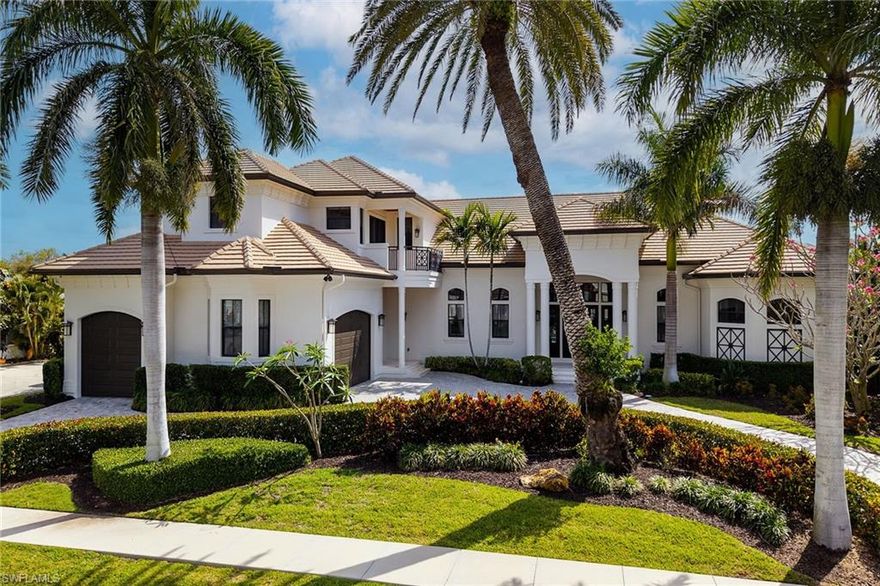 Newly renovated with new amazing updates!  Experience the pinnacle of waterfront living off of Roberts Bay in this custom, resort-style residence. Located on a tranquil street within Marco Island’s prestigious estates area, this exceptional property offers unparalleled quality and sophisticated coastal elegance. A mere mile from the pristine beach and providing swift, 10-minute access to the gulf by boat, this home is a true boater's and beach lover's paradise. Meticulously maintained and move-in ready, this residence showcases masterful craftsmanship and an unwavering attention to detail. The interiors are adorned with a sophisticated coastal flair, featuring intricate bamboo and tile flooring, dramatic coffered, and tray ceilings. The open-concept floor plan is an entertainer's delight, seamlessly blending expansive living and dining areas to embrace Southwest Florida's coveted indoor/outdoor lifestyle. Key Features & Amenities: Gourmet Chef's Kitchen: A culinary enthusiast's dream, featuring dual islands, perfect for both intimate gatherings or entertaining friends and family. Luxurious Accommodations: The estate comprises four expansive bedrooms and six bathrooms. Featuring dual master suites on the main level, the home also has maybe the nicest 6 queen bed bunkroom to be found a true masterpiece! Entertainment & Wellness Oasis: Indulge in leisure with a dedicated home theater, a dedicated exercise room with sport court flooring, a sun-drenched rooftop sundeck, and a large heated pool and spa. Boater's Haven: The property features a private dock complete with both boat and jet ski lifts, providing effortless access to the Gulf. Advanced Smart Home Technology: A fully integrated automation system provides effortless control over indoor and outdoor lighting, climate, security, irrigation, and video feeds, all at your fingertips. Practical Luxury: Additional features include an oversized four-car garage and a whole-home generator for uncompromised peace of mind and convenience. Your private island paradise and a lifestyle of unparalleled luxury await.