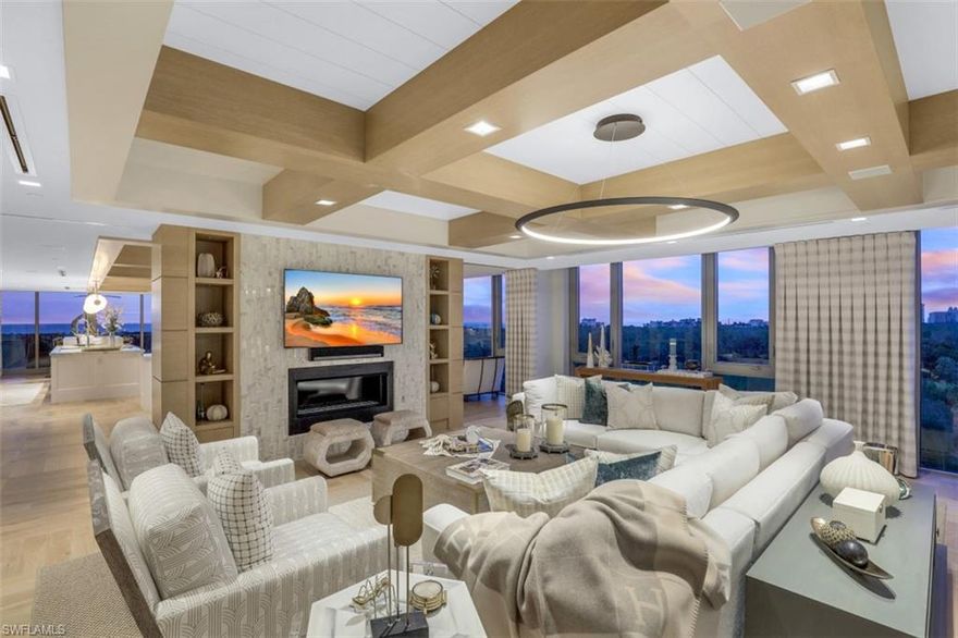 C5258.Welcome to Excellence! This Sand Dollar Award Winning design by Renee Gaddis is the essence of elegance and quality. Stunning unobstructed 180 Degree, Mile Wide Mystique Views! The “WOW” starts as soon as you enter the artistic foyer and unfolds as you walk through each room. Relax and enjoy entertaining in this 4 En-suite Bedrooms, Office, Half Bath, 2 Car Estate Living with beautiful spacious living areas to share with family and friends. This flowing space is a timeless design for today, tomorrow and beyond.  Fine Features Include: Parquet Patterned Flooring, custom crafted wood coffered ceilings, crafted Live Edge bedroom with remote control TV cabinet, master bathroom vanity-TV Mirror, Marble Wall accents, gorgeous eclectic light fixtures, soft and tonal fabric enhance guest room, bold accessories and an assortment of art complete the space and make this fabulous estate home “One-of-a Kind”. Enjoy life by just turning the key and having all your “I wants” ready to be enjoyed. Sweeping views year-round from 504, only a few steps from your resort pool, spa, fitness and tram pick up for sunset delight and 2 beachfront restaurants. Begin living the GRAND LIFE in Pelican Bay!