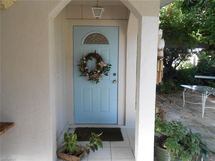 Great potential! Fruit lovers and gardeners dream with numerous fruit trees- Banana, Papaya, Mango, Black Sapote Trees, Passion Fruit, Ginger, Tumeric and the list goes on. New metal roof installed in 2015, new electrical panel 2018, freshly painted exterior 2018- ready for a new owner. This home has an in-law apartment with separate entrance and screened in porch. Two bedrooms in front with one and 1/2 baths and a large bedroom apartment in rear with full bath and kitchen. An interior door has been added to access the apartment and could easily be removed. Laundry room is located in carport with extra storage room. Close to the beach, Naples Park Community Garden and great shopping at the Mercato. Selling as is.