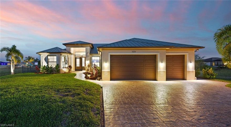 Welcome to your dream waterfront oasis! This exquisite, custom-built home features 3 bedrooms and 3 baths. The home is a boater's paradise, with just a short boat ride to Pine Island Sound and the Gulf of Mexico. As you step inside, you'll be greeted by a stunning Great Room floor plan. The gourmet eat-in kitchen boasts quartz countertops, stainless appliances, a breakfast bar, and a delightful dinette area.

Entertaining is a breeze with 90-degree sliders that seamlessly open onto the expansive under-truss lanai with its built-in grill and exhaust vent. The spacious pool, complete with a swim platform, provides an ideal spot for family activities while overlooking the picturesque intersecting canal.

The composite dock is a boater's delight, featuring a 10,000 lb boat lift with a canopy. The 3-car garage features oversized garage doors. Impact windows and doors throughout with electric shutters. The list of upgrades and features is extensive, making this property a unique gem in the real estate market. Close to shopping and dining.

Schedule your private tour today to start living your SW Florida Dream before the end of the year!