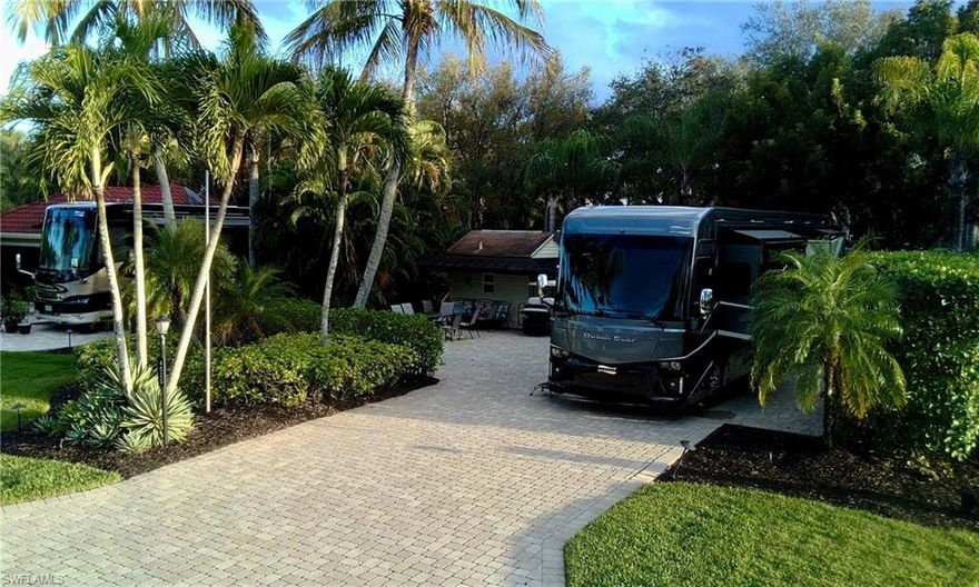 This Class A motorcoach only site is located in the gated community of Pelican Lake Motorcoach Resort.  The property is an end site with only one neighbor and a large green space along the West side of the property, This is a  off-lake site with southern exposure and close to the centrally located clubhouse and amenities.  Finished with an expanded paver pad, lush tropical landscaping, and full RV hookups.