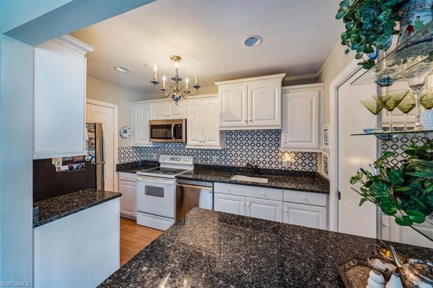 C4344. This coastal contemporary home is a perfect winter retreat and offered turnkey furnished. The 2nd floor residence has been beautifully updated & is one of Park Shore’s best-kept secrets. Hidden Lake Villas offers a resort lifestyle in this desirable location-West of 41 & less than a mile to the beach, shopping & fine dining. Savor the morning sun and a cup of coffee from your private lanai with views of the pool, tennis courts & lake. Enjoy the gorgeous kitchen with upgraded cabinets, backsplash, granite counter tops & deep under mount sink. The master bath has a new vanity and glass enclosed walk-in shower with floor-to-ceiling Italian marble. The home is complete with Italian marble flooring, plantation shutters, hurricane impact sliding glass doors & windows and newer AC (2018). Just a short walk to the resort-style Geo-Thermal heated swimming pool, tennis courts, pickleball, clubhouse, fitness room, party room & a library. Residents can obtain an optional membership to Park Shore Association for private beach access at Raymond Lutgert Park. Located in the heart of Naples with easy access to enjoy all that Southwest Florida has to offer.