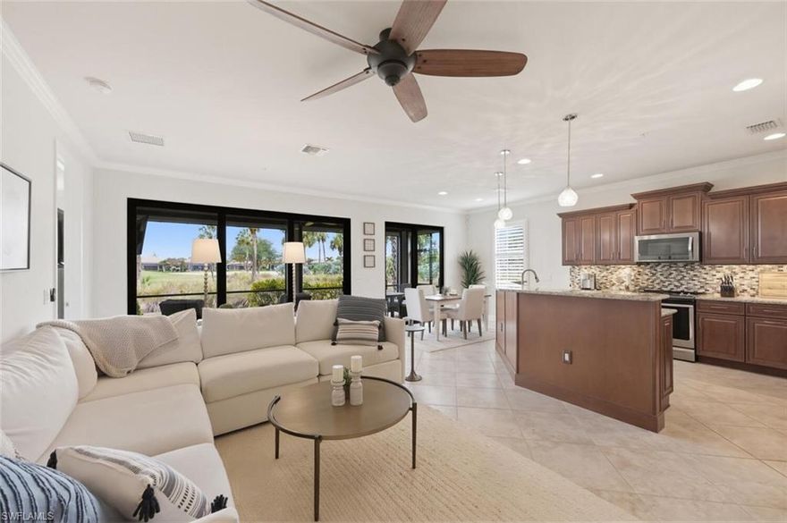 Experience the ultimate Naples golf lifestyle in this beautifully updated first-floor coach home in TwinEagles, offering immediate Full Golf Membership and tranquil views of the 8th green on the Eagle Course. Built in 2015, this residence features a highly desirable open great-room floor plan created by removing the original kitchen wall, allowing the kitchen, dining, and living spaces to flow seamlessly together while maximizing natural light and golf course views. The home offers three bedrooms, two bathrooms, and an attached two-car garage, with no carpet throughout, impact-resistant windows and doors, and plantation shutters on every window. The kitchen is designed for both everyday living and entertaining with granite countertops, stainless steel appliances, and abundant cabinetry, while the spacious primary suite provides peaceful golf course views. Additional highlights include Kevlar hurricane-rated electric screens on the lanai, upgraded lighting, organized shelving in all closets and a 2022 Club Car golf cart with upgraded Lithium battery, custom leather seats and bluetooth sound system included with the home.
Step outside to the screened lanai overlooking the green at hole #8, the perfect setting for morning coffee or evening sunsets. Ideally located directly across from the community pool, this home combines privacy with convenience. TwinEagles spans over 1,100 acres of pristine natural beauty and features 36 holes of championship golf designed by Jack Nicklaus and Steve Smyers, along with a recently renovated clubhouse offering fine and casual dining, a resort-style pool, fitness center, tennis, pickleball, bocce, and an active social calendar. With immediate golf membership deeded to the property and world-class amenities at your doorstep, this residence presents an exceptional opportunity to enjoy the luxury golf lifestyle that defines TwinEagles.