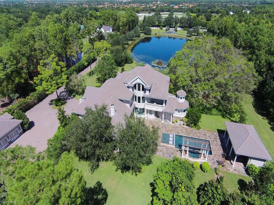 H.13137 - Spacious Livingston Woods Estate built by Chris Van Emmerik in 2008, penned by Weber Design featuring 6,720 sq ft, 5Bdrms/Den/5 full + 1half baths. Masterfully built and perfectly appointed with Thermador and Wolf appliances, gas heated, WiFi controlled pool and spa, outdoor cabana, kitchen, and gas fire pit. But that’s not all! This beautiful estate can boast a private guest house with over 2,557 sq ft with 3Bdrms/3Bths. All this and more comes on 7.5 acres of land with a stocked deep-water pond, fruit trees (oranges, lemons, limes, pomelos, grapefruit, pomegranate, mango, avocado, coconut palms, fig, lychee and starfruit) privacy wall, gated entry, five air-conditioned garages, and room to include whatever you can dream. This is an exceptional opportunity to enjoy the benefits of living on a beautiful and well-kept estate sized property that also lends itself to the equestrian lifestyle.