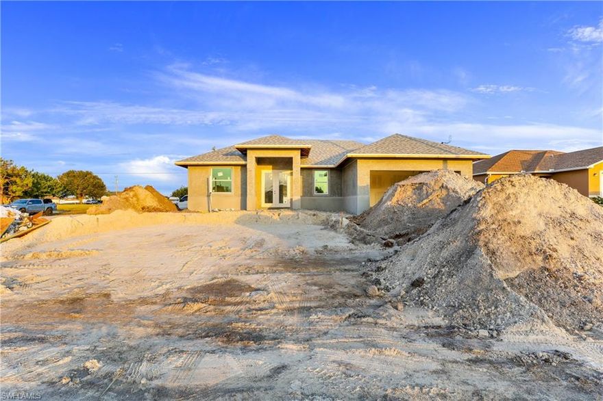DON'T WAIT!! **Complete by the end of March 2021** Welcome to NW of Cape Coral, one of the fastest growing areas in the beautiful city of Cape Coral !! This wonderful modern open concept, brand new Single Family Home "Santa Fe Model” features nearly 1,550 Sq. Ft of living space, 3 large bedroom , 2 Full new bathrooms with Quartz, 2 car garage . Freshly painted inside and out, epoxy in garage, new kitchen with soft-close cabinets, Quartz counter tops, island, new stainless steel appliances, new 8 foot tall doors, new based boards,  new AC system, new light fixtures, new plumbing, new smoke detectors, alarm system new water heater, new well equipment. Home is equipped with Taex built-in pest control system, irrigation system, hurricane impact doors and windows, laundry room, Spacious master bedroom, new master bath, double-sink, 1 huge walk-in closet, new plank tile throughout the home. The location is close to many of Cape Coral top schools, closer to US 41, North Fort Myers, hospitals, shopping, dining, entertainment & less than 30 mins to SW Florida International Airport, NO HOA Fees. This home will not last! Renderings photos.