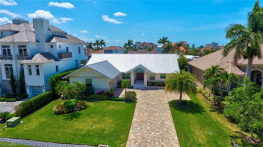 This well-appointed, totally refurbished, single family waterfront residence could be perfect for the discerning buyer looking to enjoy that true Florida Lifestyle! One of the few areas in Naples offering single family waterfront living with both Beach and Gulf access! Grab that favorite refreshment and head to the Beach for Sunset! Boat to the Gulf of Mexico and make waves! Looking to catch that elusive Snook.. here is your chance.. from the backyard!