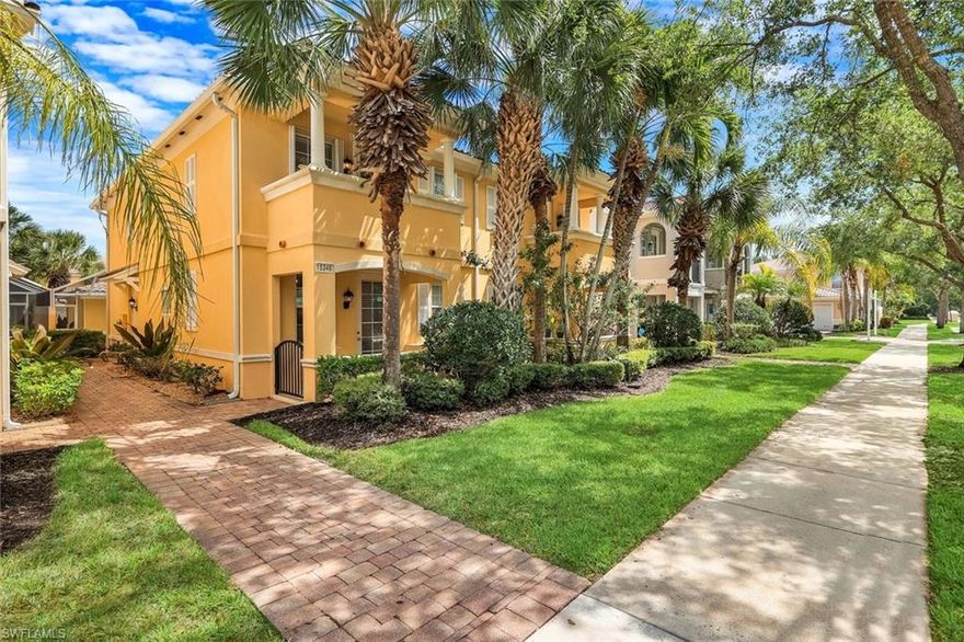 Welcome to Village Walk of Bonita Springs, where comfort, convenience, and resort-style living come together in this beautifully maintained turnkey furnished townhome. Featuring light coastal décor and a spacious layout, this home easily accommodates a large family or guests, making it an exceptional value. Offering three bedrooms, three full baths, and a two-car garage, the flexible floor plan is designed for both everyday living and entertaining. The first floor includes a private bedroom suite with a full bath, walk-in closet, and access to a secluded patio—ideal as a primary suite or guest retreat. Tile flooring runs throughout the main level, complemented by a custom built-in wall unit and a spacious screened lanai. The kitchen is tastefully updated with a marble backsplash and enhanced recessed lighting, creating a bright, functional space. Upstairs, a wood-accented staircase leads to two en-suite bedrooms with walk-in closets and wood laminate flooring. One suite features a soaking tub and private balcony overlooking the Town Center, while both baths include walk-in showers. Ideally located near the hub of the community, directly across from the Town Center, residents enjoy immediate access to Village Walk’s exceptional amenities, including a resort-style pool, lap pool, eight Har-Tru tennis courts, fitness center, and convenient on-site services such as a bank, post office, gas station, car wash, park, and restaurant—all within a 24-hour guard-gated community. Located in one of Southwest Florida’s fastest-growing areas, this move-in-ready home offers the perfect blend of lifestyle, location, and value.
