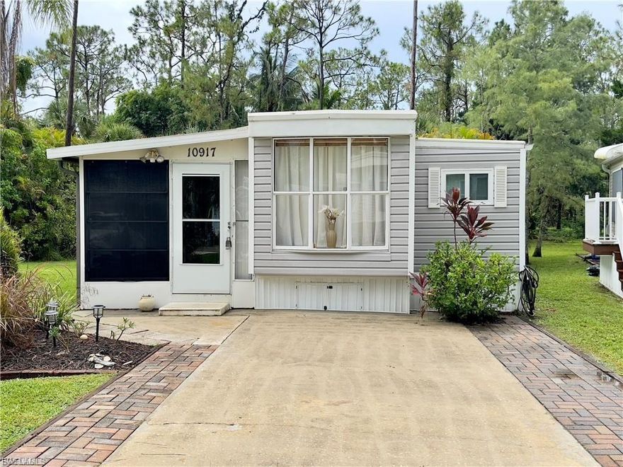 Enjoy this quaint Florida Oasis! Low HOA fees, taxes, and you own the land! 1 bedroom/ 1 bath with 2 sofa sleepers manufactured home. Newer windows, newer siding, newer AC, newer roof, recently remodeled bathroom, wide driveway, premier lot, fully furnished. This is a very active community park where you own the land your home sits on. Amenities include Pickle Ball, Bocce ball, tennis and shuffle ball courts, a huge swimming pool and spa, a butterfly garden, nature trails with bridges for bikers, hikers, or golf carts. A 23-acre lake to enjoy plus many more! Close to shopping, dining, and the Southwest Florida International Airport.