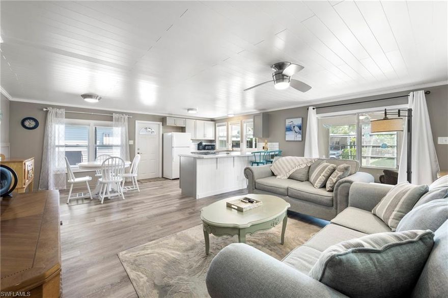 Nestled in Coachlight Manor, a 55+ river-access community in Fort Myers, this 2-bedroom, 2-bath manufactured home offers a vibrant, active-adult lifestyle with easy boating and social opportunities. The community provides river access with a private boat ramp, only 20mins to open water, clubhouse, and regular events, along with essential amenities like a pool, fitness center, and well-maintained common areas. The home itself features a practical layout, a bright open living area, a functional kitchen with modern appliances, and easy maintenance with vinyl flooring throughout. An inside laundry option and a covered front porch add convenience and comfortable outdoor living.

This setup makes the home appealing for seasonal Florida residents or those seeking full-time retirement living, offering both relaxation and opportunities for engagement within the community. Proximity to Fort Myers beaches, dining, and shopping adds convenience for outings and day trips.  Boat Storage available for only $200/year.  Do not miss your opportunity to own this amazing home, what are you waiting for?  Call now!