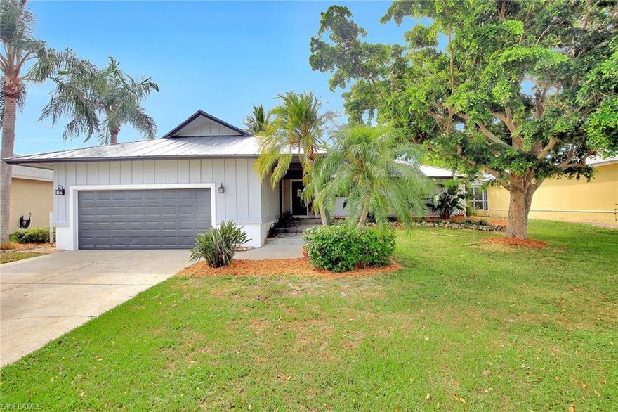 Wonderful pool home in a neighborhood of nice homes. Very well maintained with three bedrooms, two baths and lots of updates including new metal roof, air conditioner and hot water heater are a year old. Skylit living room and kitchen with stainless appliances and a new dishwasher, granite counters and marble backsplash, breakfast nook and breakfast bar. Other features include travertine marble floors throughout, plantation shutters in the living room, updated bathrooms with granite, beadboard wainscoting in hall bath and dining area. All this and a sunny southeastern rear exposure.