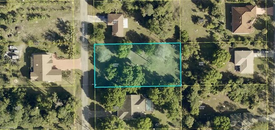 Residential building lot on a nicely paved street. Half acre lot that has been mostly cleared with some majestic Oak trees for shade. Quiet low traffic street.